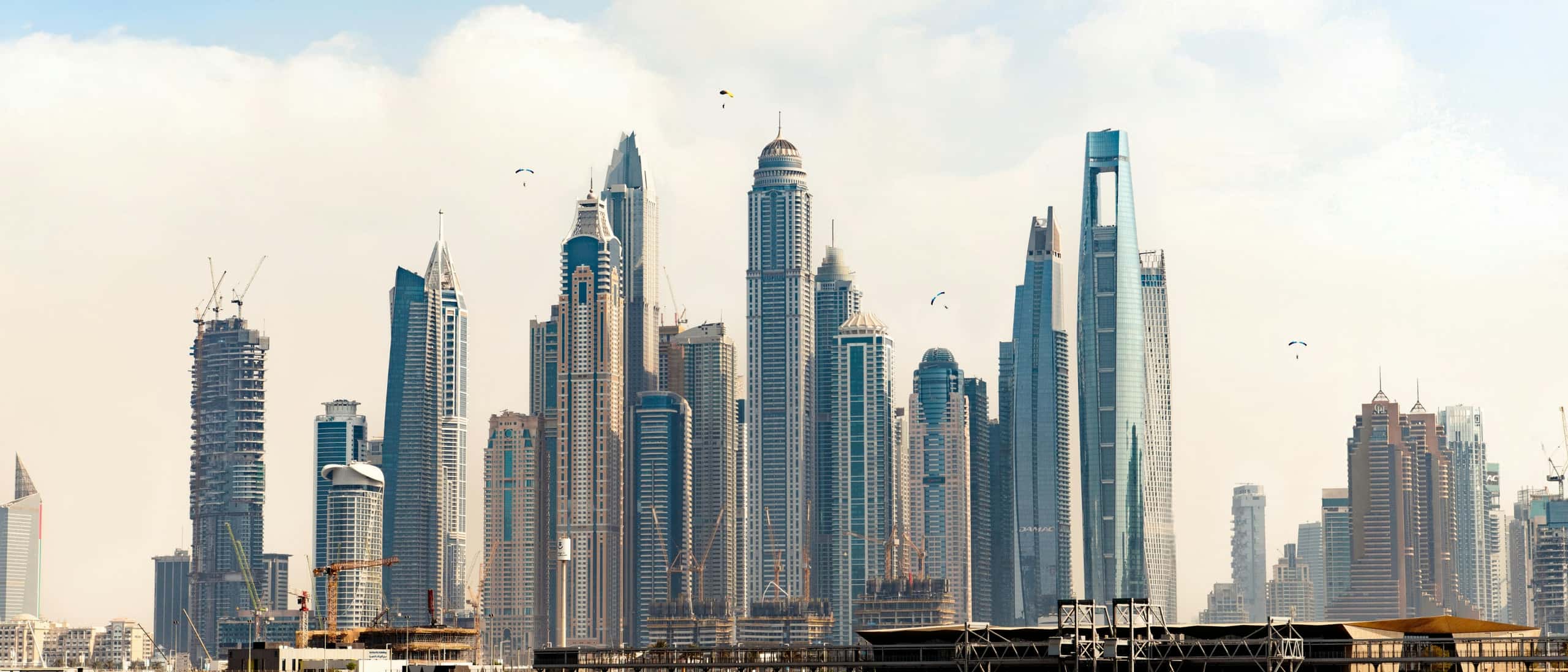 UAE — Dubai skyline and desert dunes