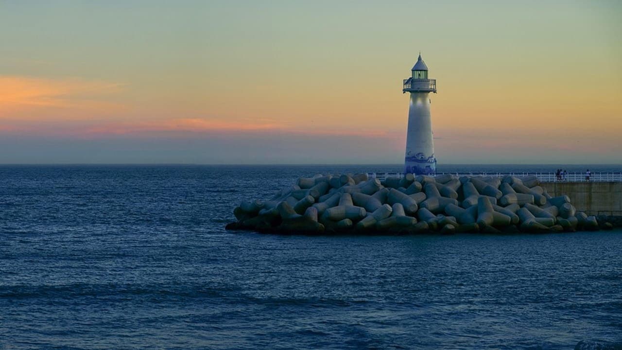 Lighthouse off the Busan coastline at dusk